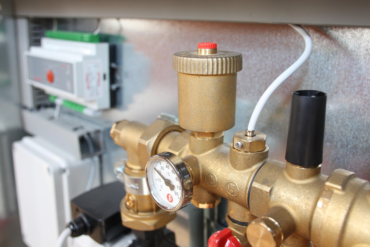 Brass manifold with a temperature gauge on a heating unit